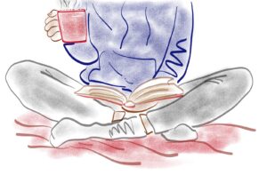 Taking time out to read a book and enjoy a hot drink are low cost self-care tips